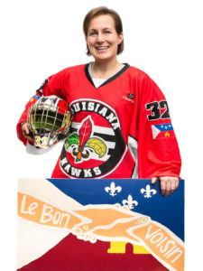Young woman in a hockey uniform.